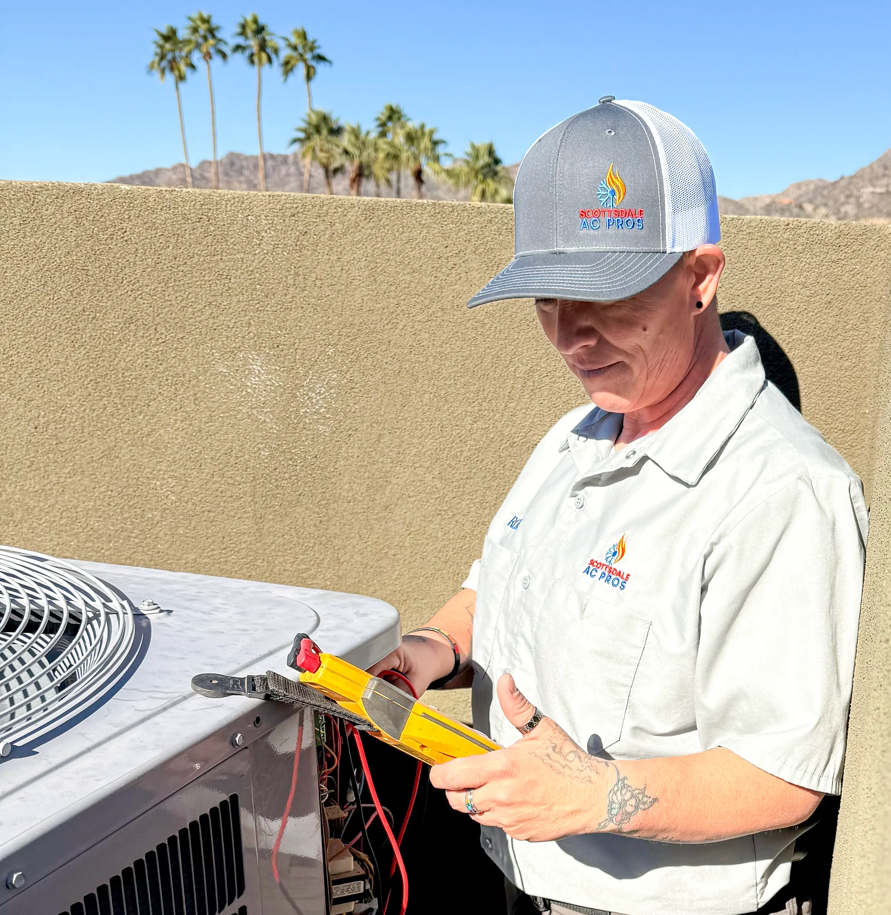 HVAC technician installing new air conditioning system