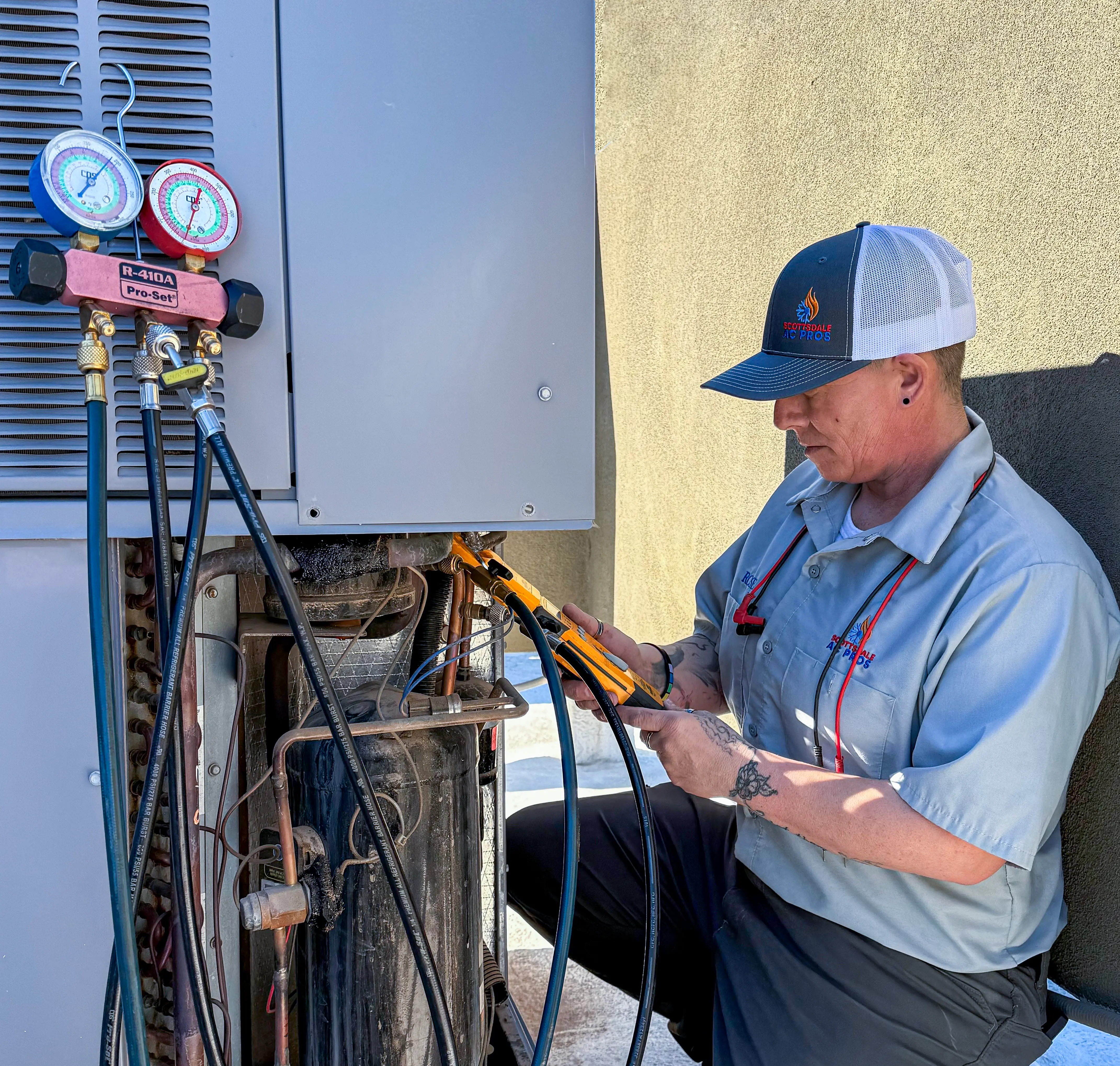 Technician performing preventive AC maintenance