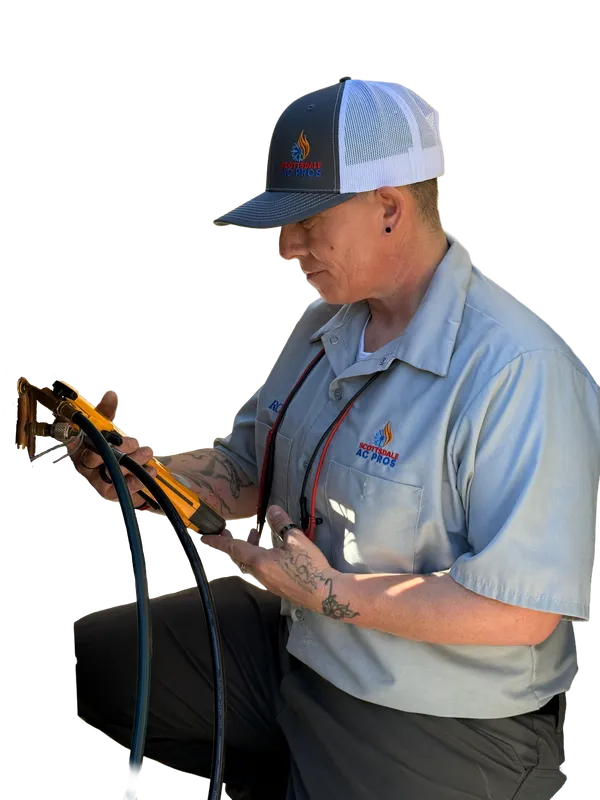 Scottsdale AC Pros technician reading HVAC gauges